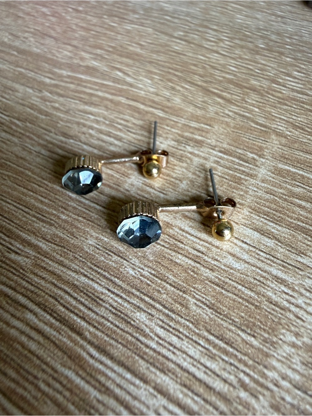 Gold Tone Stud Earrings with Faceted Gray Gem